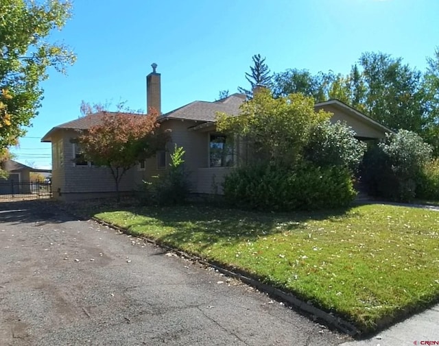 view of home's exterior with a lawn