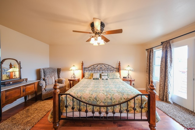 bedroom with ceiling fan and dark hardwood / wood-style flooring