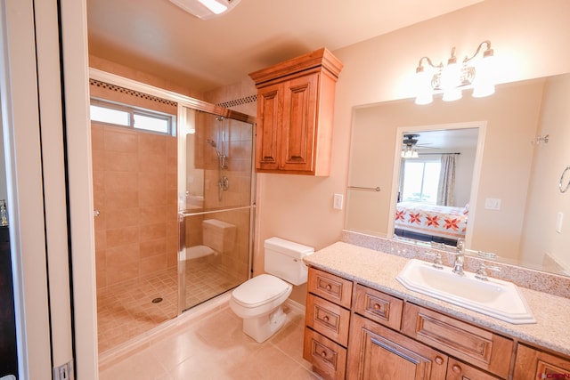 bathroom with vanity, toilet, walk in shower, and a wealth of natural light