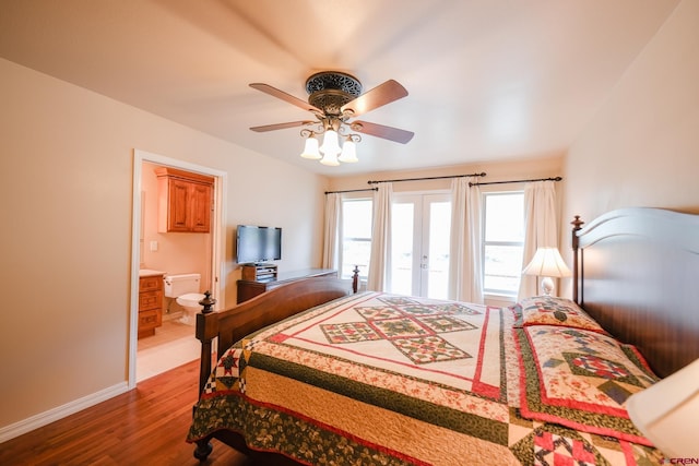 bedroom featuring ensuite bathroom, hardwood / wood-style flooring, french doors, and ceiling fan