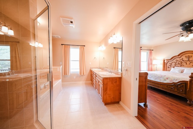 bathroom with vanity, tile patterned floors, walk in shower, and plenty of natural light