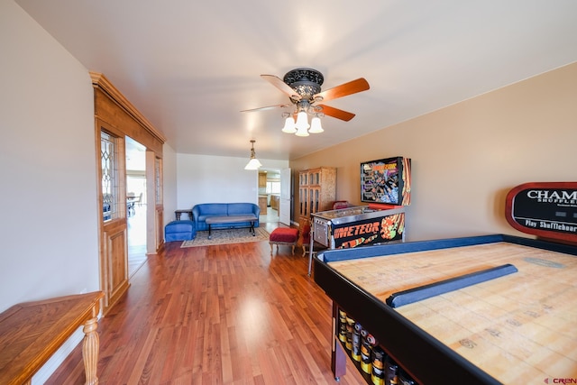 bedroom with hardwood / wood-style floors and ceiling fan