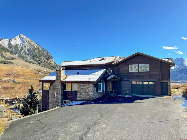 view of front of house featuring a mountain view and a garage