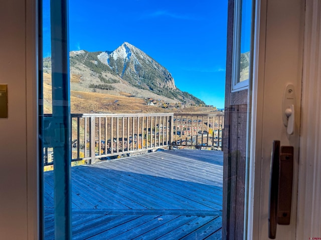 wooden terrace featuring a mountain view