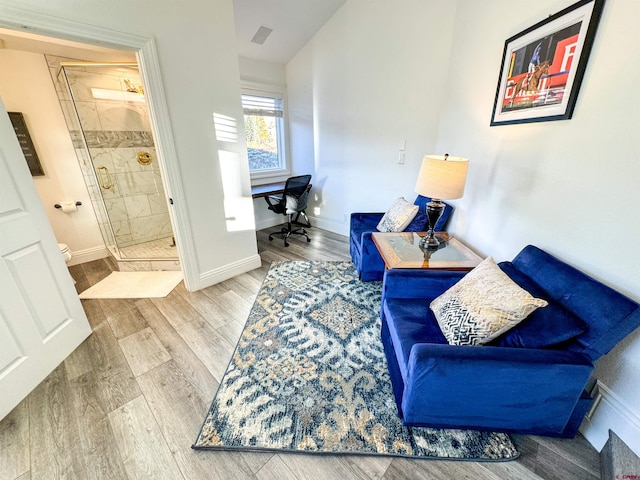 living area with hardwood / wood-style floors