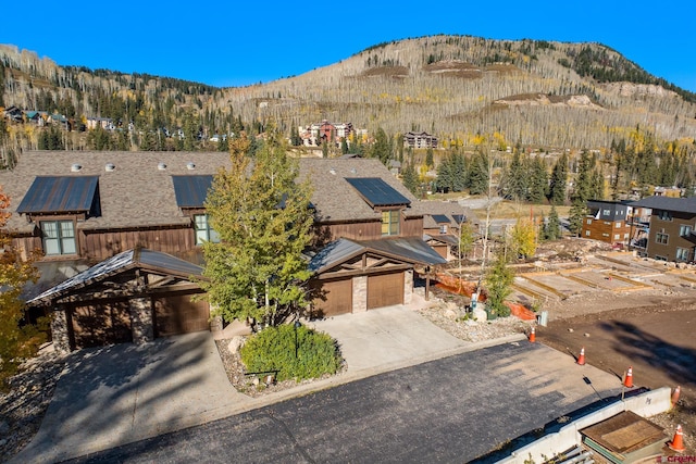 drone / aerial view featuring a mountain view