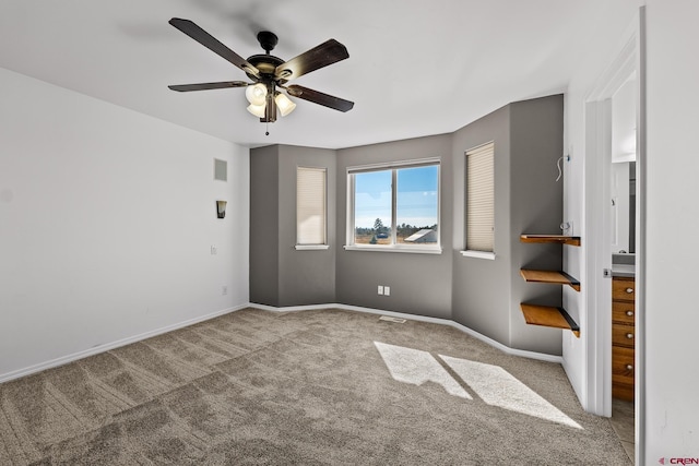 spare room with ceiling fan and carpet flooring