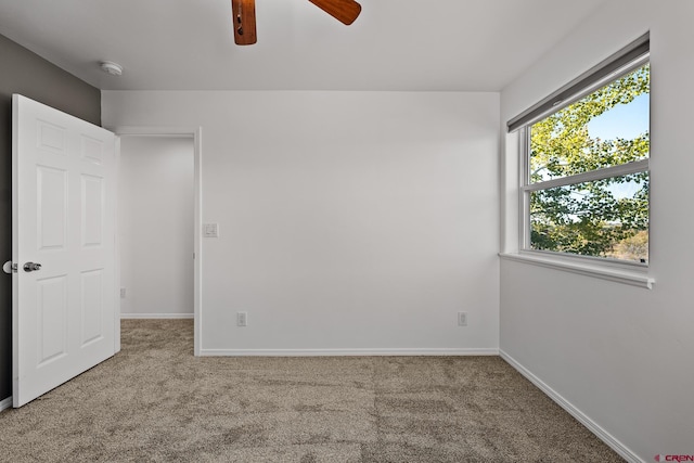 unfurnished bedroom with carpet floors and ceiling fan