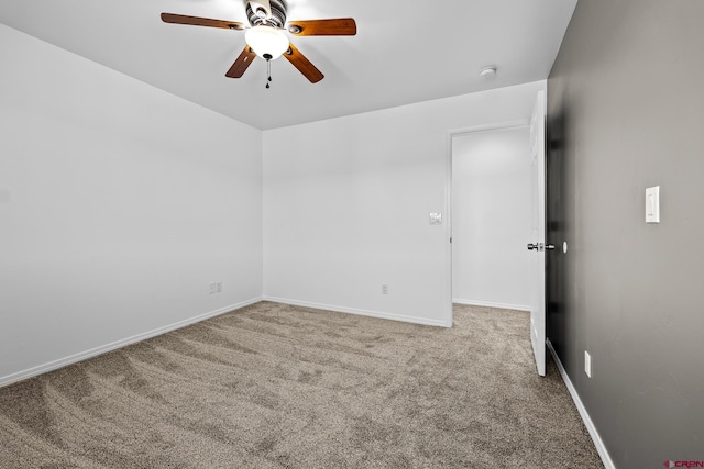 unfurnished room featuring light colored carpet and ceiling fan