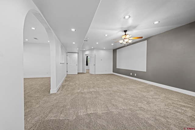 carpeted empty room featuring ceiling fan