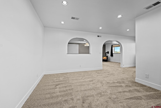 empty room featuring light carpet