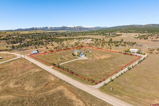 bird's eye view featuring a rural view and a mountain view