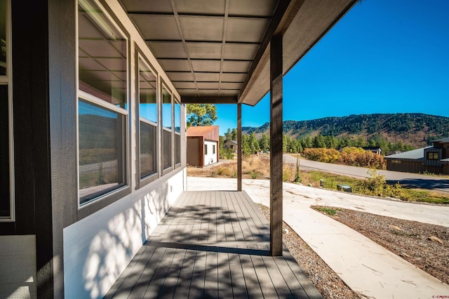 view of patio featuring a deck with mountain view