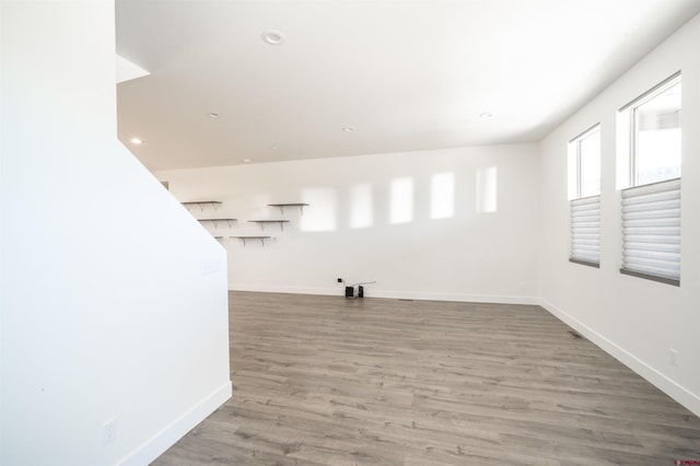 empty room with hardwood / wood-style flooring