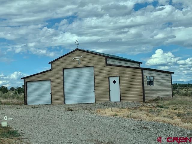 view of outbuilding featuring a garage