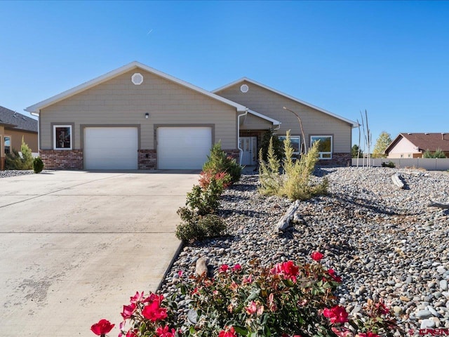 ranch-style home featuring a garage