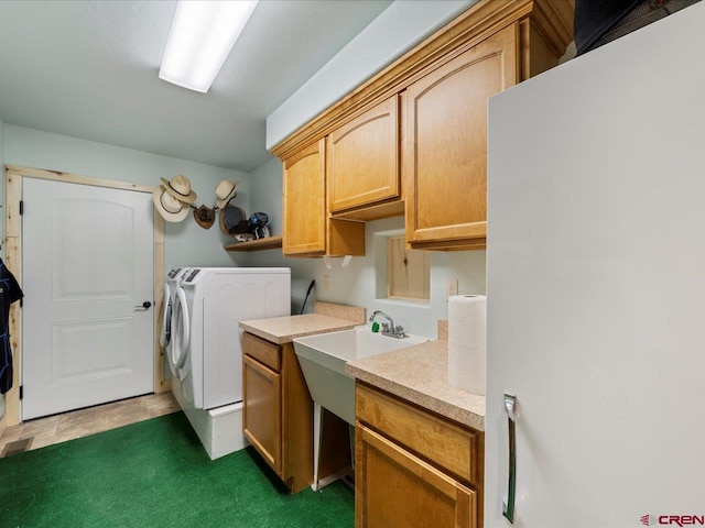 laundry room with cabinets, independent washer and dryer, and dark carpet