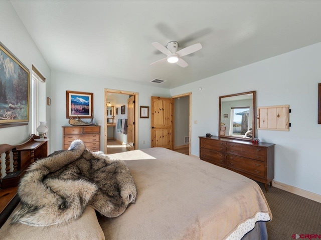 bedroom with connected bathroom, carpet, and ceiling fan