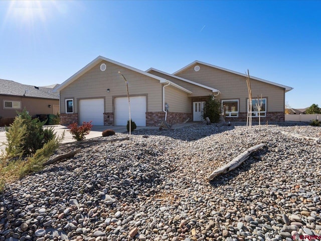 ranch-style house featuring a garage