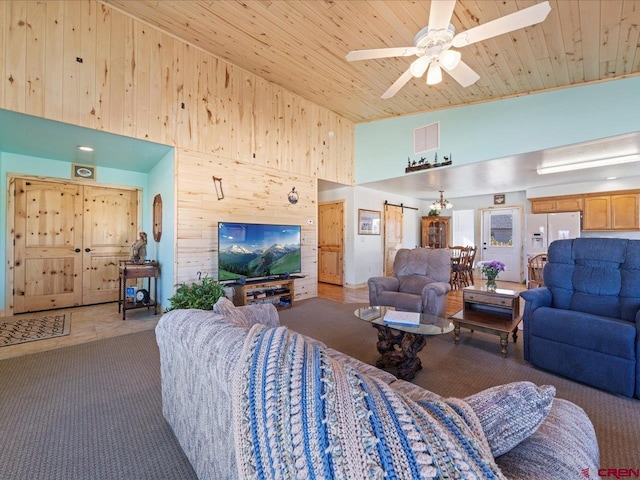 living room with a barn door, carpet floors, high vaulted ceiling, and wooden ceiling