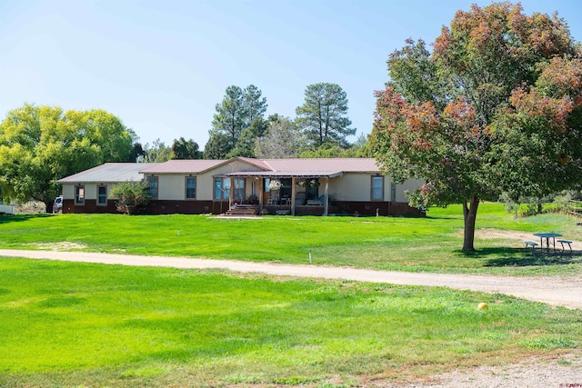 single story home featuring a front lawn and covered porch