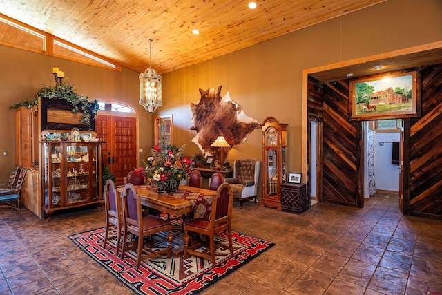 dining room with wood ceiling and high vaulted ceiling