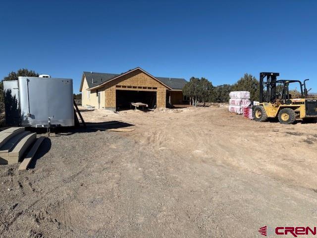 view of yard featuring a garage