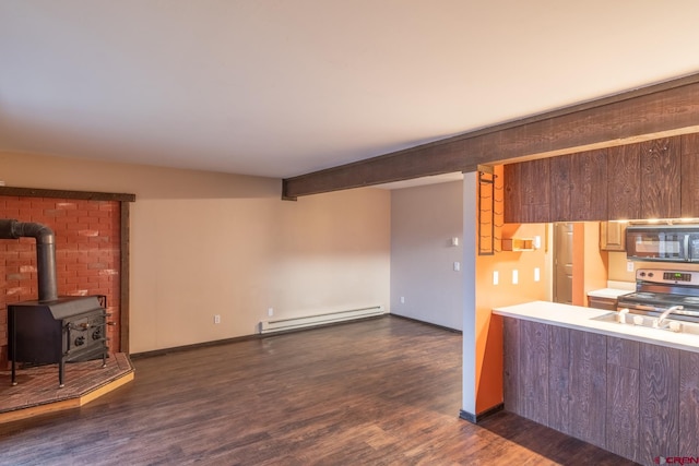 kitchen with a baseboard heating unit, stainless steel range oven, a wood stove, beam ceiling, and dark hardwood / wood-style floors