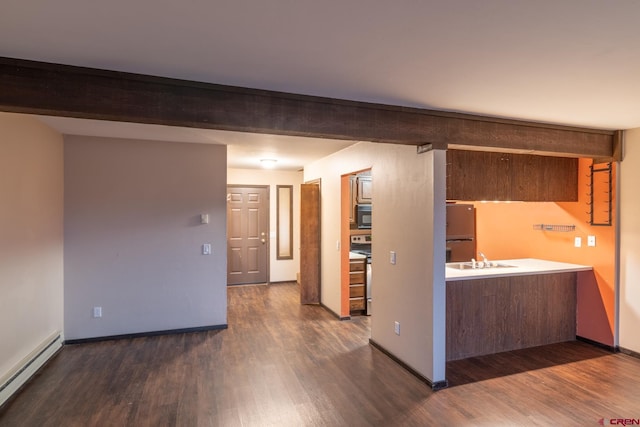 interior space with sink, a baseboard radiator, and dark hardwood / wood-style floors