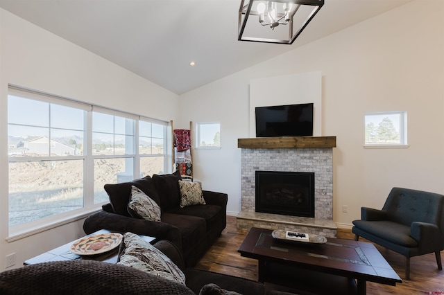 living room featuring an inviting chandelier, lofted ceiling, and dark hardwood / wood-style flooring