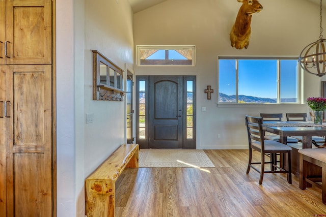 entryway featuring hardwood / wood-style flooring and vaulted ceiling