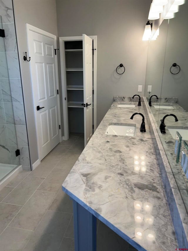 bathroom with vanity, tile patterned floors, and an enclosed shower