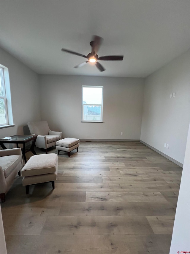 unfurnished room featuring light hardwood / wood-style floors and ceiling fan