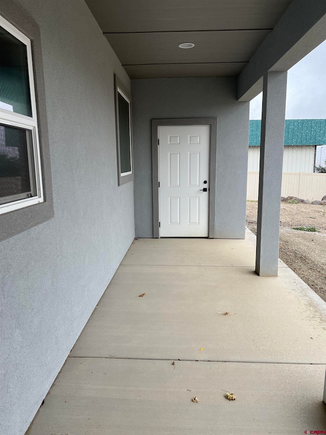 property entrance with a patio