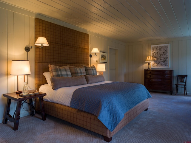 bedroom with wood ceiling, wood walls, and carpet flooring