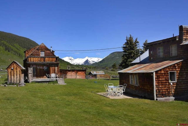 view of yard with a patio area and a mountain view