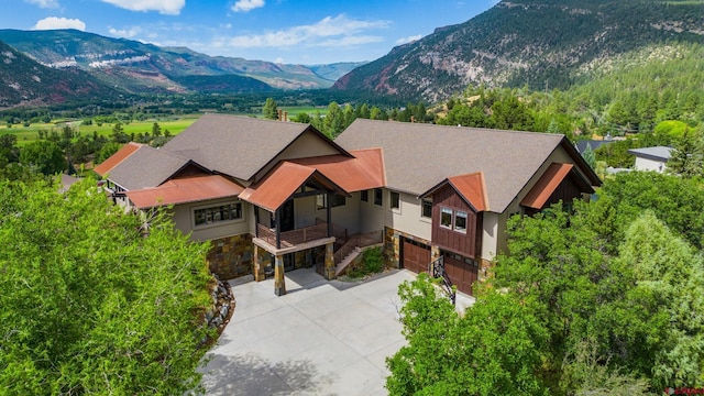 birds eye view of property with a mountain view