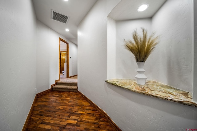 hall featuring wood finished floors, recessed lighting, and baseboards