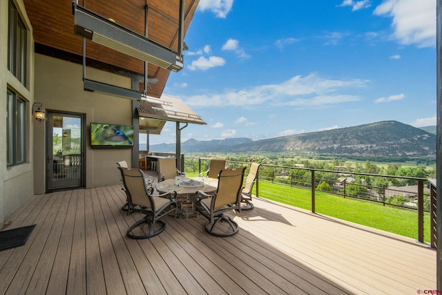 wooden terrace featuring a mountain view