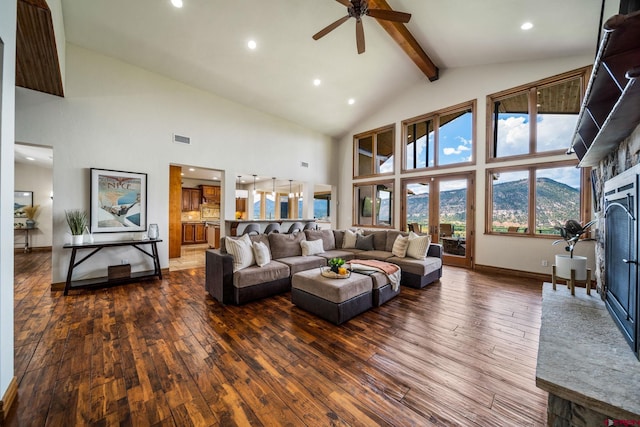 living room featuring beam ceiling, high vaulted ceiling, a mountain view, and dark hardwood / wood-style floors