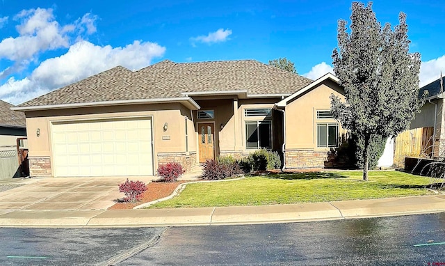 view of front of property with a front yard and a garage