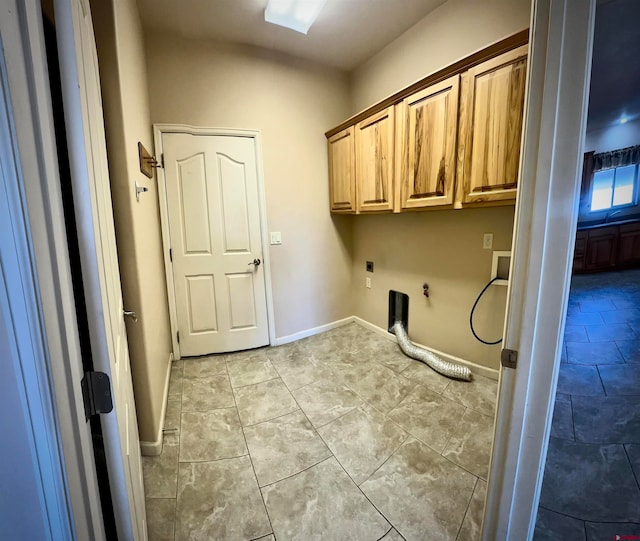 washroom featuring cabinets, hookup for an electric dryer, gas dryer hookup, and hookup for a washing machine