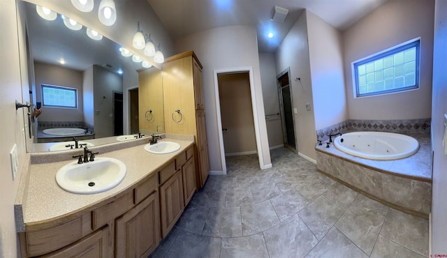 bathroom with separate shower and tub, a wealth of natural light, tile patterned flooring, and vanity