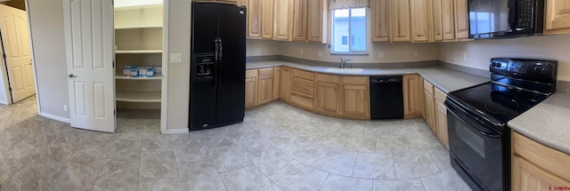 kitchen featuring black appliances, sink, and light brown cabinetry