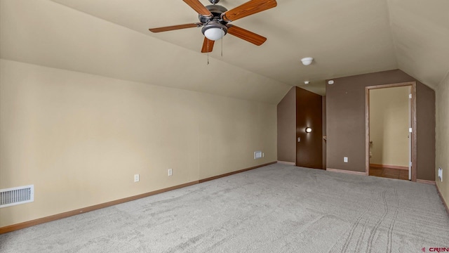 bonus room with lofted ceiling, carpet floors, and ceiling fan