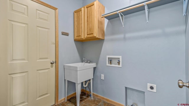 laundry room featuring hookup for a washing machine, electric dryer hookup, and cabinets