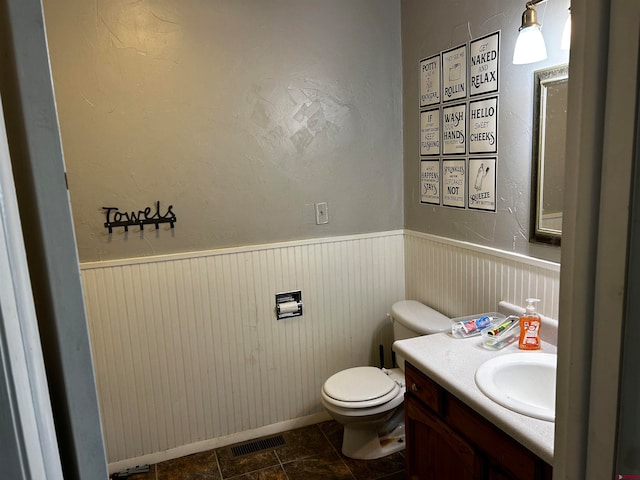 bathroom with vanity and toilet