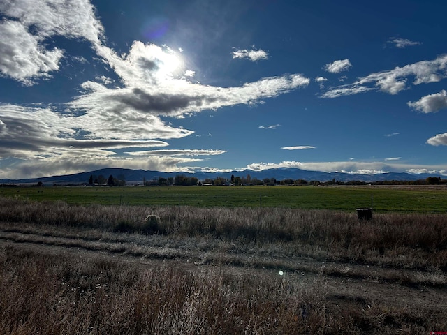 mountain view featuring a rural view