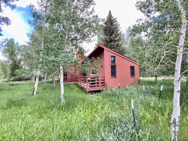 view of yard with a wooden deck