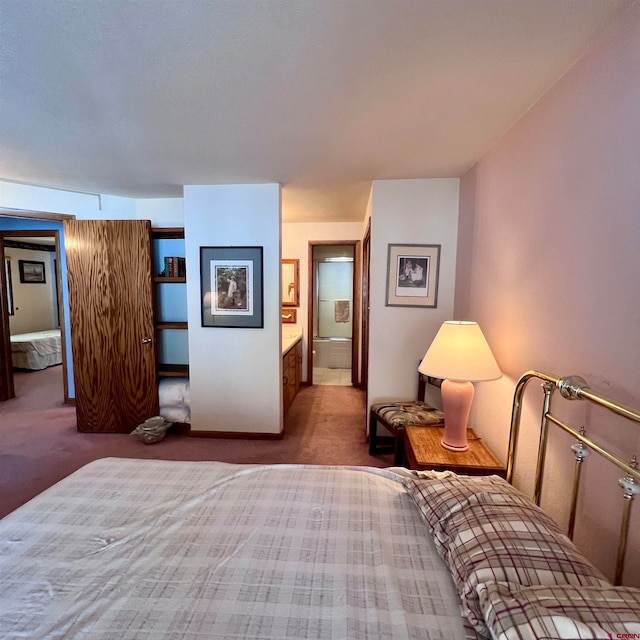 carpeted bedroom featuring ensuite bath